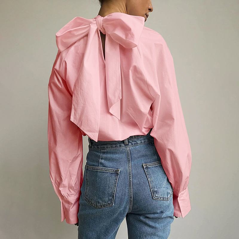 Roze blouse met strik