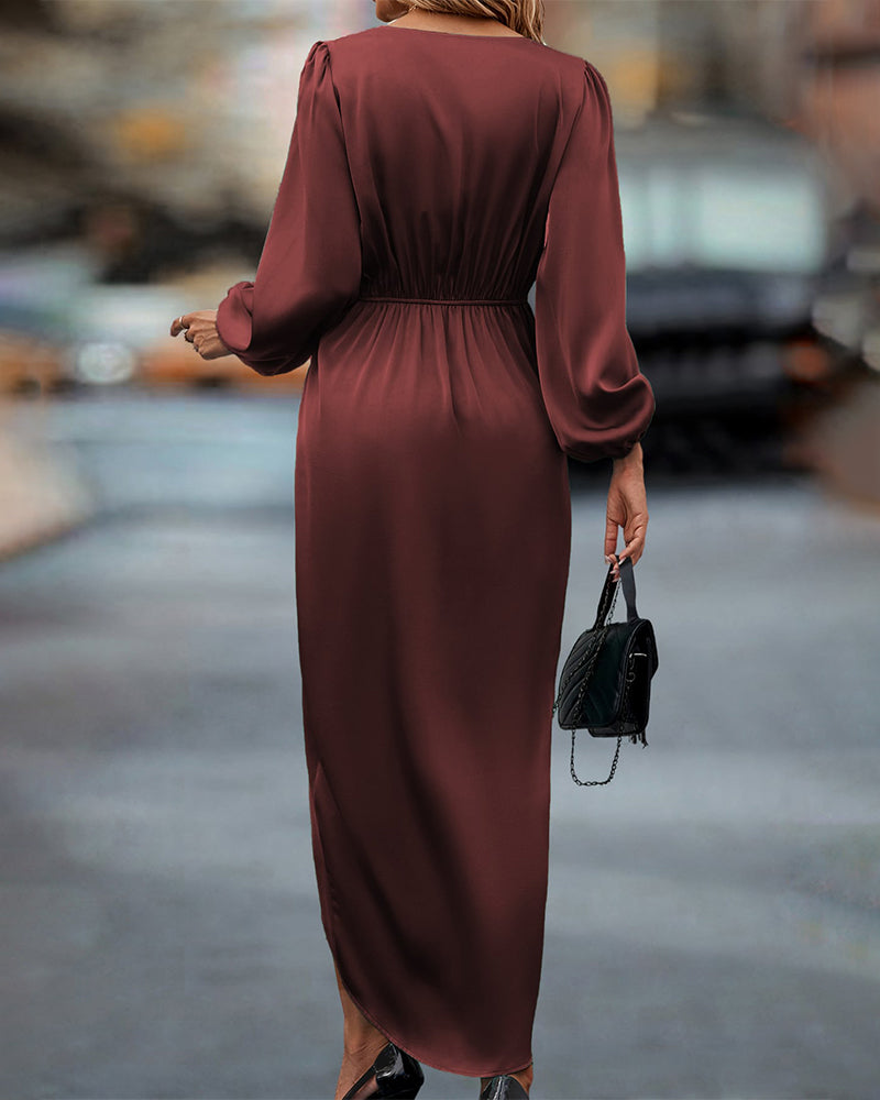 Elegante jurk met lantaarnmouwen en v-halslijn