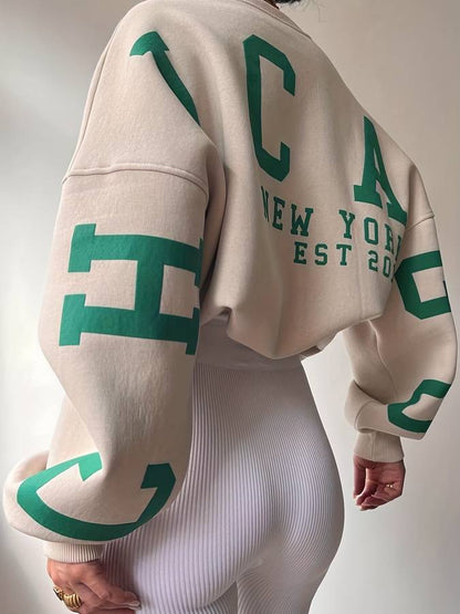 Beige sweater met tekst