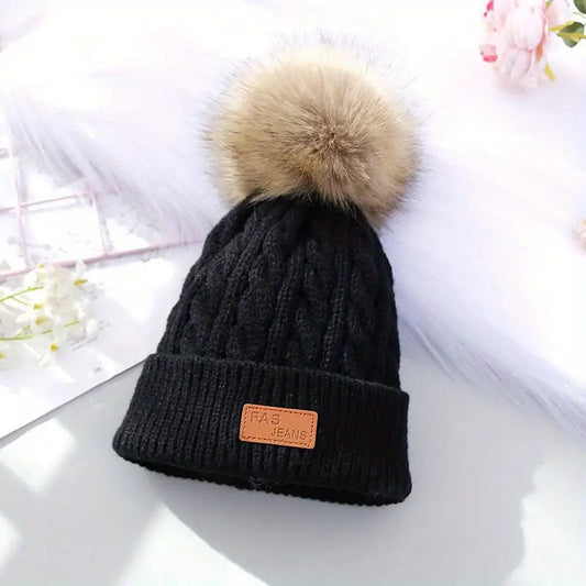Gebreide pompom muts