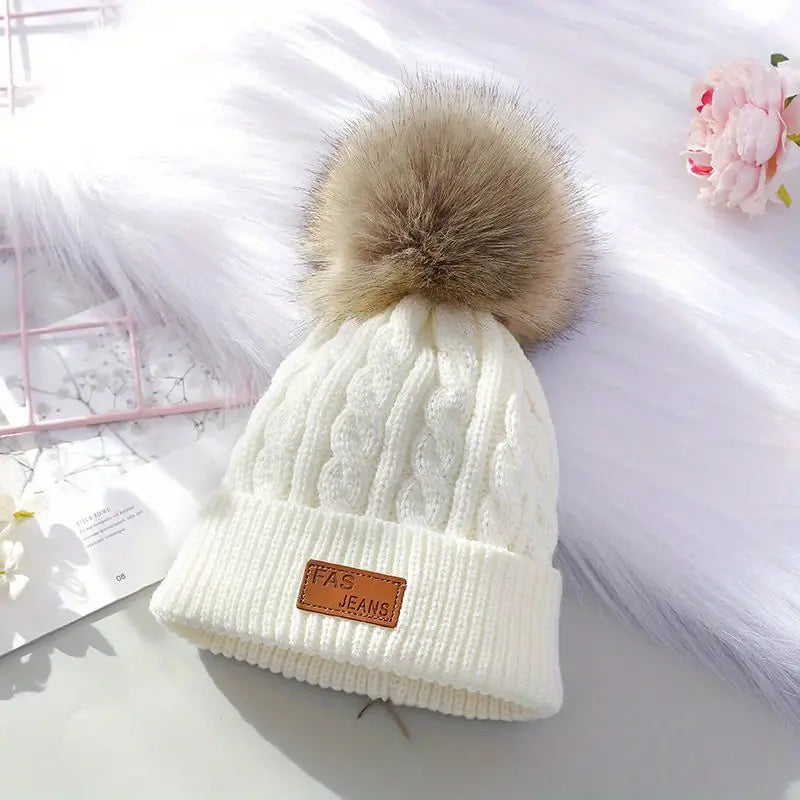 Gebreide pompom muts