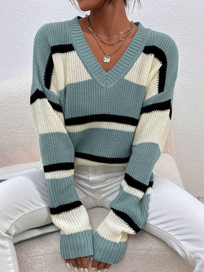 Geblokte V-hals trui