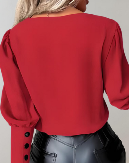 Akeisha | Tweekleurige damestop met V-hals en lange mouwen met meerdere knopen als detail