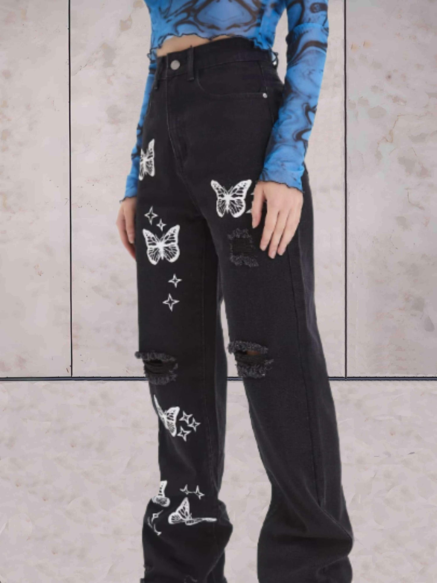 Ciara - Gescheurde jeans wijde pijpen met vlinders patroon
