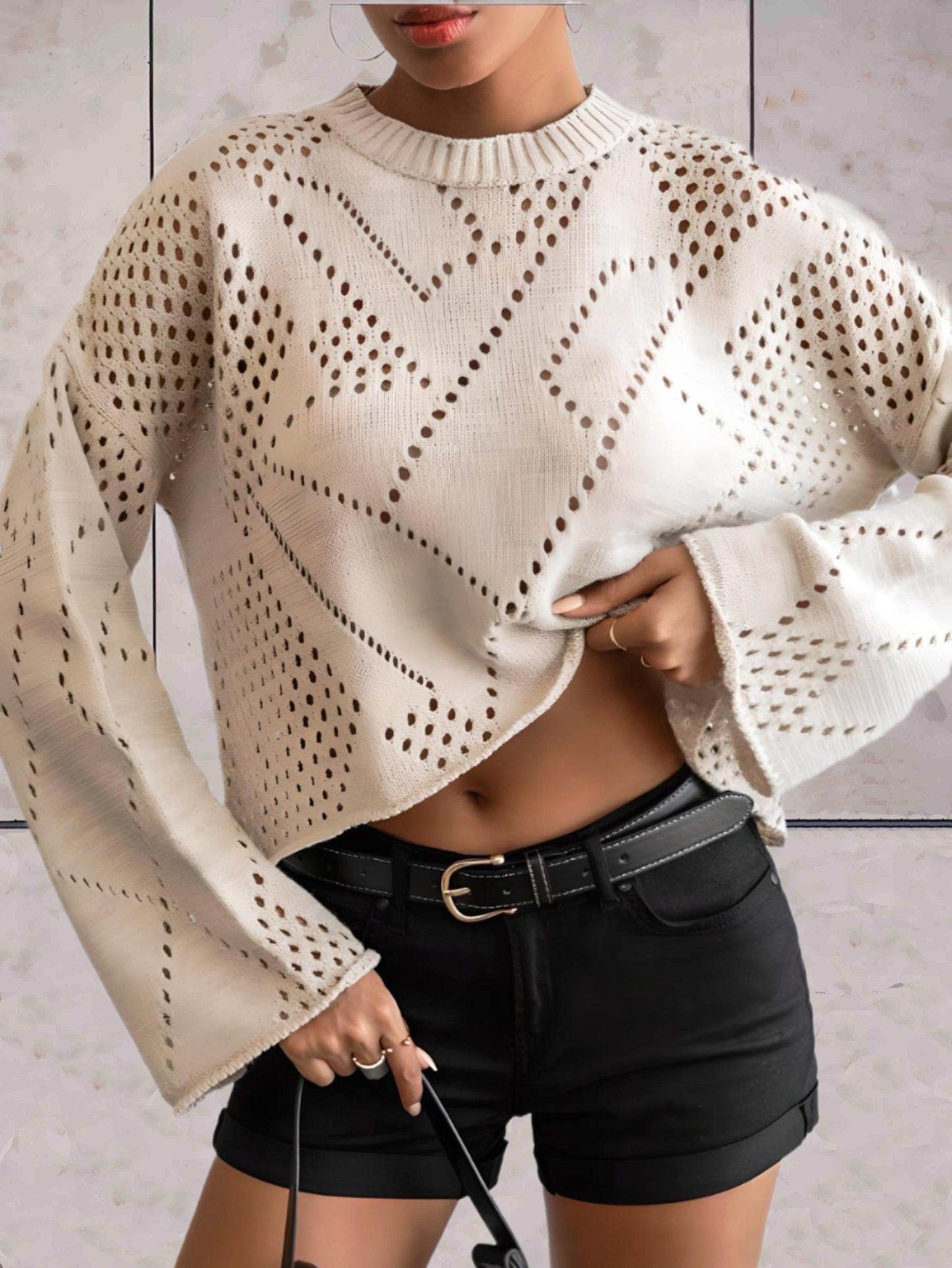 Evalina - Off white oversized sweater met ronde hals en abstract stippen dessin