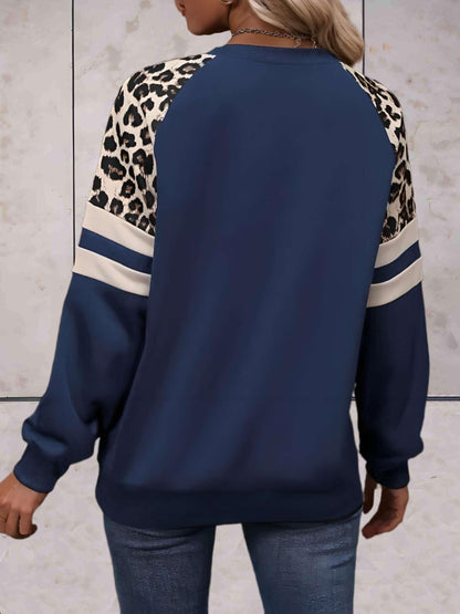 Ezra - Mooi aansluitende sweater met luipaardprint op de mouwen