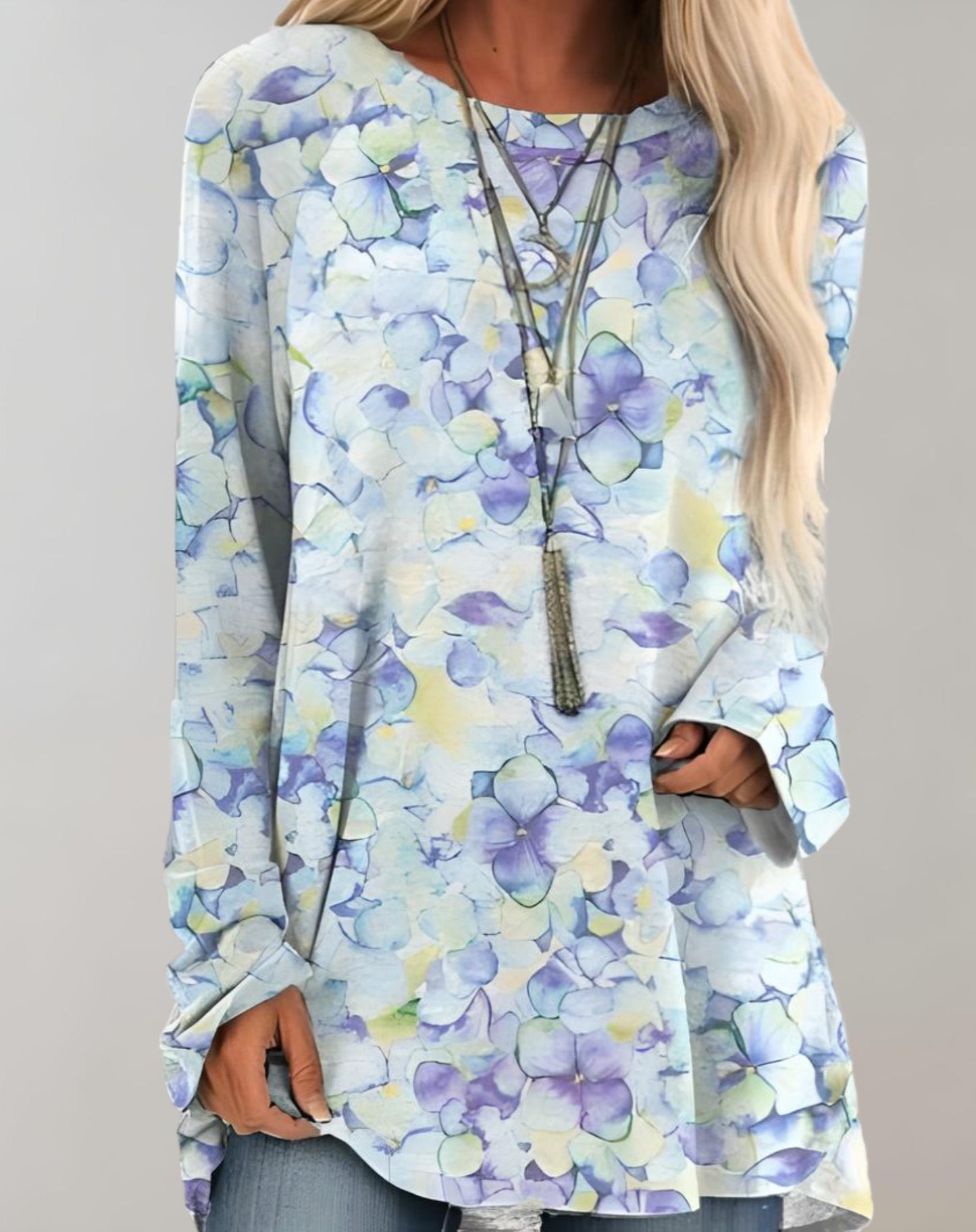 Klarissa | Lange zwierige oversized sweater met bloemdessin en zijzak