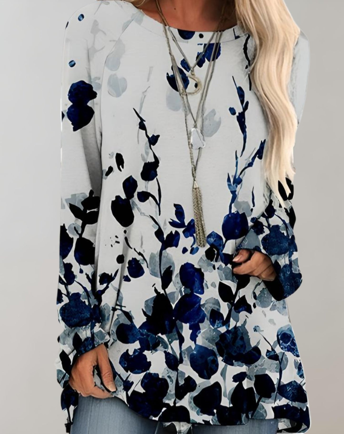 Klarissa | Lange zwierige oversized sweater met bloemdessin en zijzak