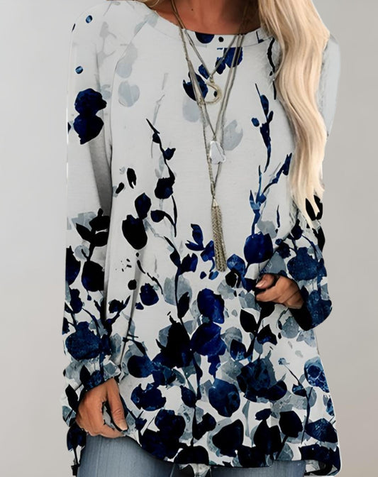 Klarissa | Lange zwierige oversized sweater met bloemdessin en zijzak