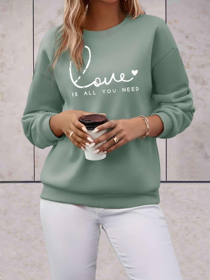 Madison -  Lange trui met liefde is alles wat je nodig hebt statement design vooraan