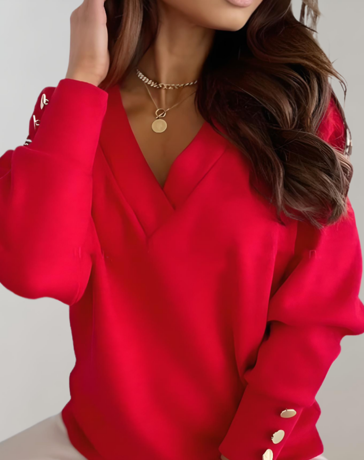 Nyssa | Eenvoudige trui met een v-hals en knopen op de mouw