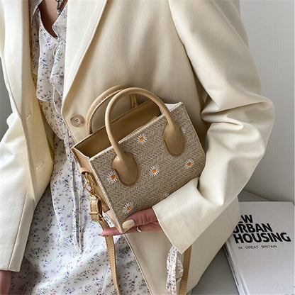 Daisy | Geweven handtas met bloemenaccenten