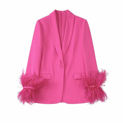 Roze blazer met veren