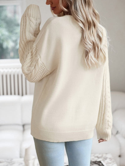 Beige trui met knitted mouwen
