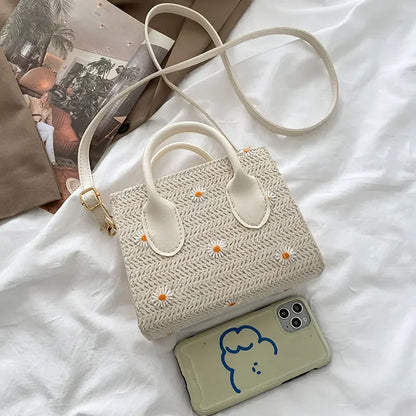 Daisy | Geweven handtas met bloemenaccenten