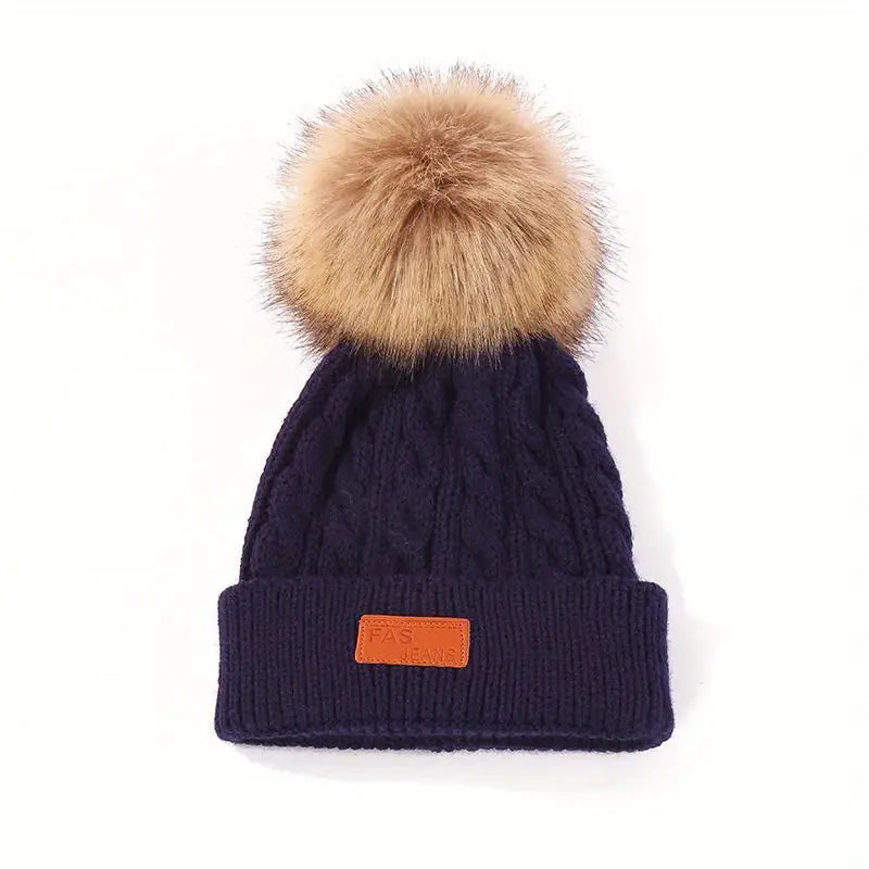 Gebreide pompom muts