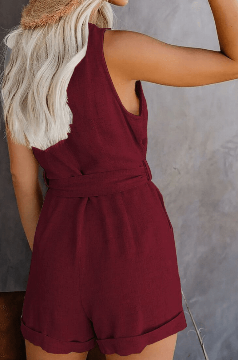 Olivia | mouwloze romper met knoopsluiting en strikceintuur