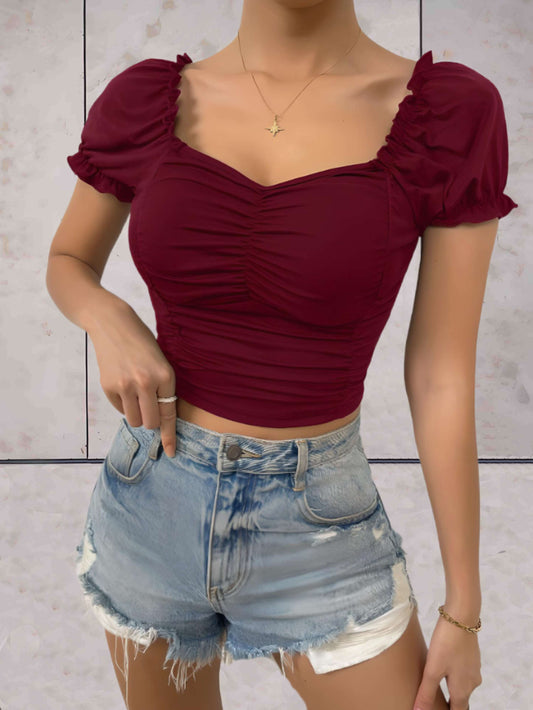 Chelsea - Bodycon cropped top met lage v-uitsnijding en gezwollen korte mouwen