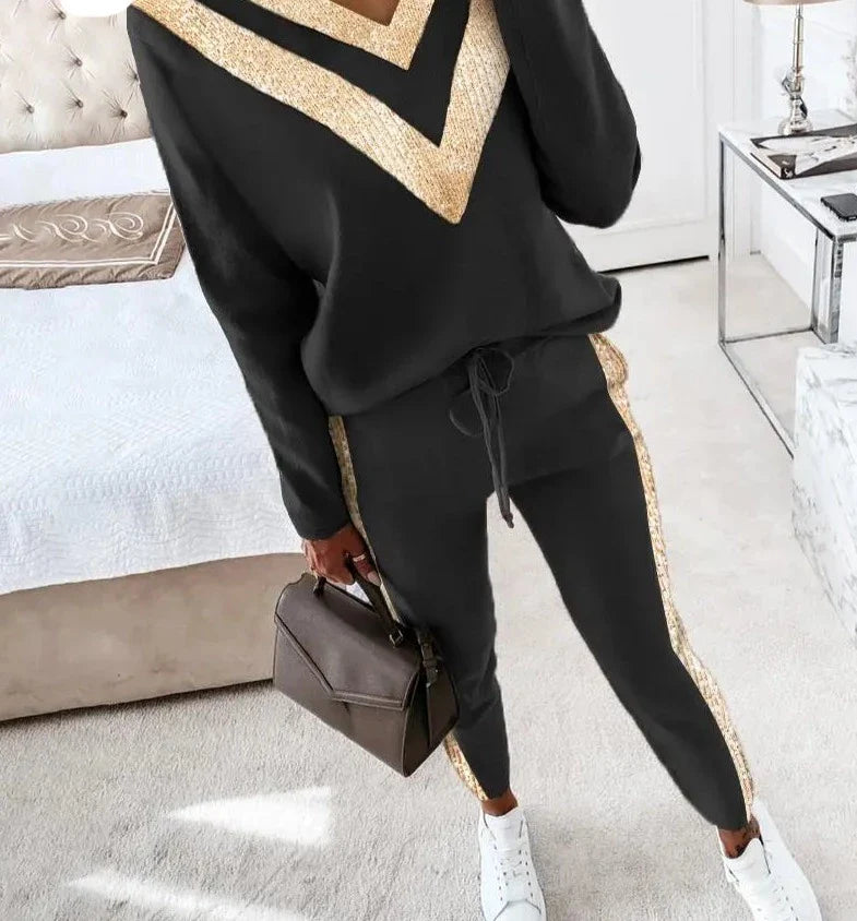 Zwart joggingpak met goud