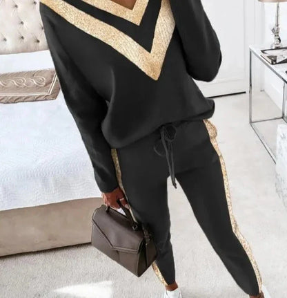 Zwart joggingpak met goud