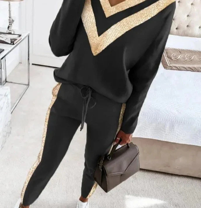 Zwart joggingpak met goud