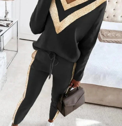 Zwart joggingpak met goud