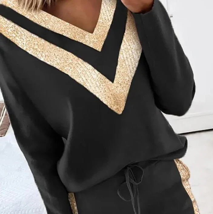 Zwart joggingpak met goud