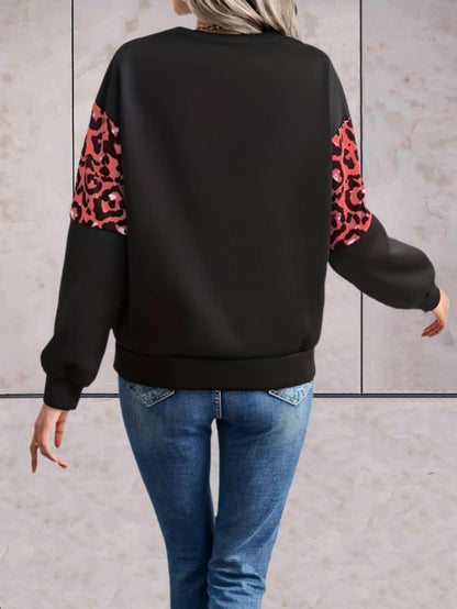 Chloe - Oversized trui met ronde hals en luipaardprint in het midden